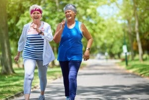 two ladies walking on a path