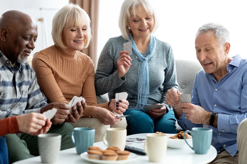 Senior friends playing cards